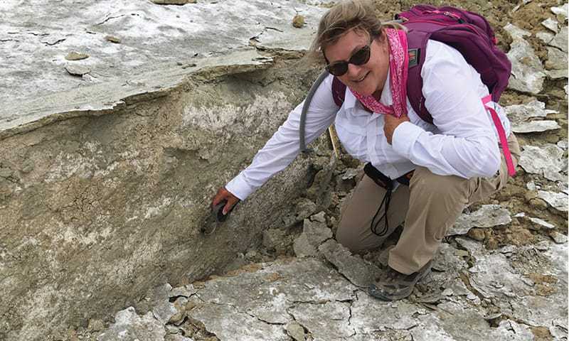 Alumni Janis Hernandez posed at the site of an earthquake near Ridgecrest.
